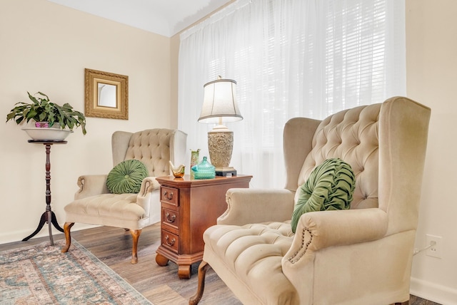 sitting room featuring wood finished floors and baseboards