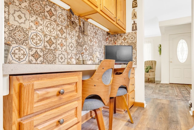 office space featuring light wood-style floors and baseboards