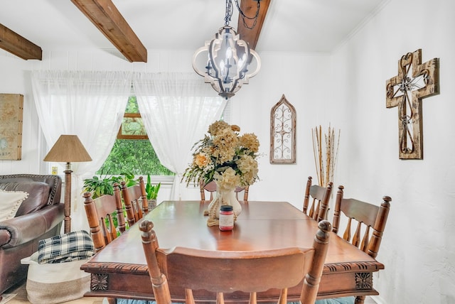 dining space featuring a chandelier and beamed ceiling