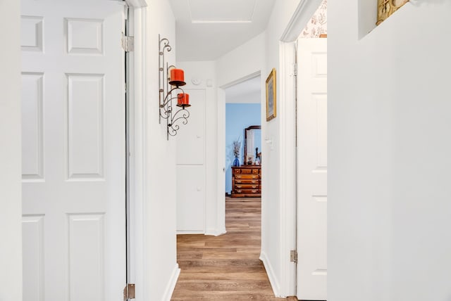 corridor with light wood-style flooring