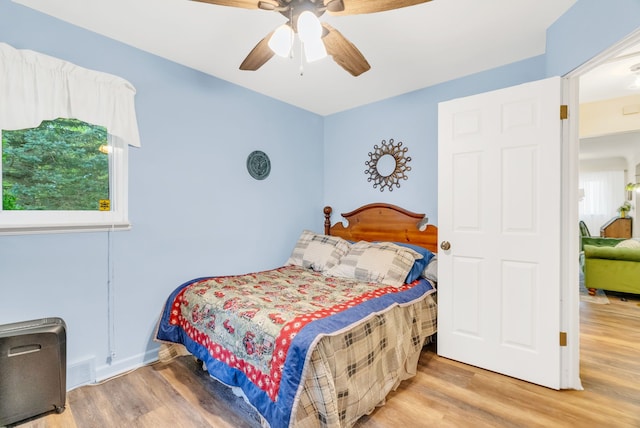 bedroom with wood finished floors and ceiling fan