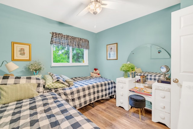 bedroom featuring wood finished floors and ceiling fan