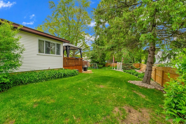 view of yard with a gazebo and a wooden deck