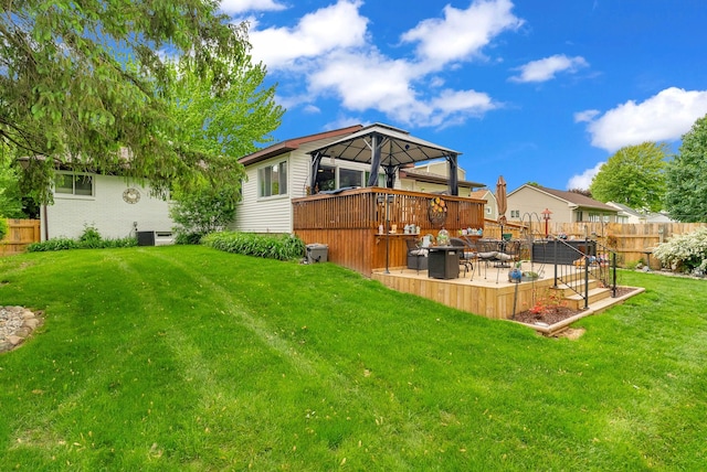 rear view of house featuring a gazebo, a patio area, and a deck
