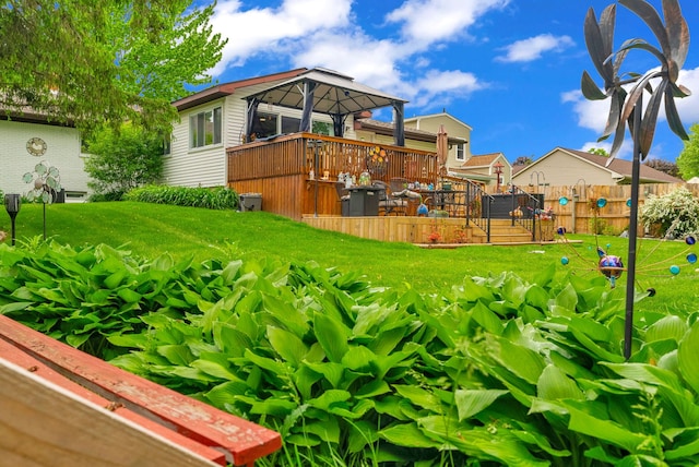 view of yard with a gazebo and a wooden deck