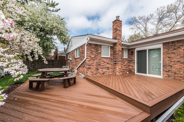wooden deck with outdoor dining area