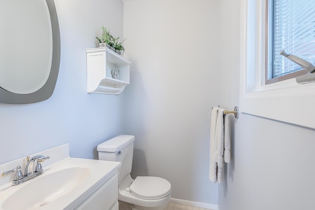 bathroom with toilet and vanity