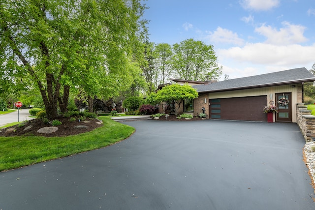 4749 Tara, West Bloomfield, MI 48323 - view of front facade featuring driveway, a garage, and a shingled roof