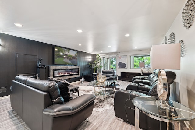 4749 Tara, West Bloomfield, MI 48323 - living area with a glass covered fireplace, recessed lighting, and light wood-type flooring