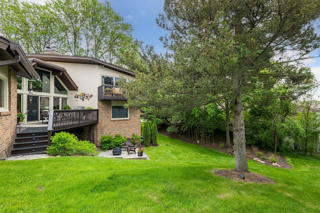 4749 Tara, West Bloomfield, MI 48323 - view of grassy yard with an outdoor fire pit, a deck, and a patio area