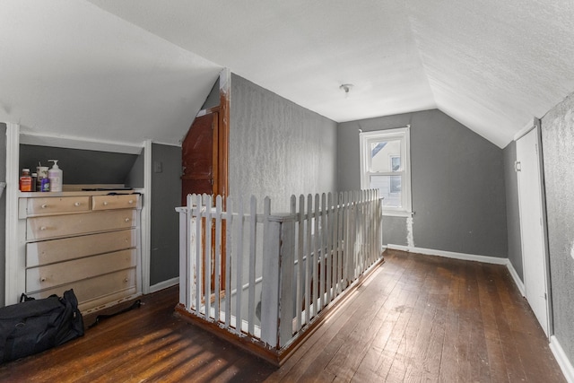 9069 Pierson St, Detroit, MI 48228 - additional living space featuring vaulted ceiling, wood-type flooring, and baseboards
