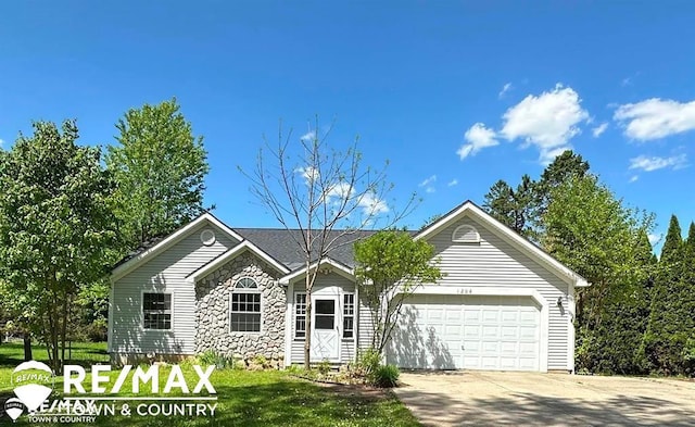 1208 Turrill Rd, Lapeer, MI 48446 - ranch-style house with an attached garage, stone siding, and driveway