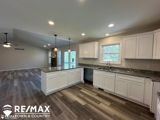 1208 Turrill Rd, Lapeer, MI 48446 - kitchen with a sink, a peninsula, white cabinets, healthy amount of natural light, and recessed lighting