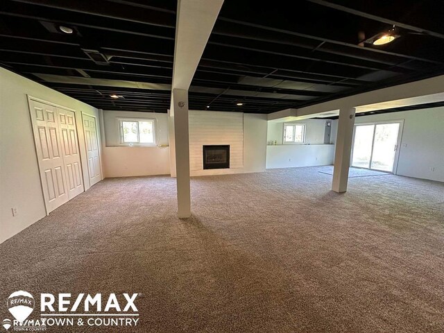 1208 Turrill Rd, Lapeer, MI 48446 - basement featuring carpet floors and a large fireplace