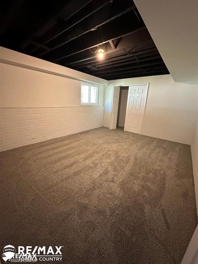 1208 Turrill Rd, Lapeer, MI 48446 - basement featuring brick wall and carpet flooring