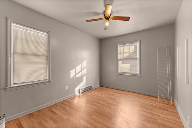 7285 Mansfield St, Detroit, MI 48228 - unfurnished room with light wood finished floors, baseboards, and ceiling fan
