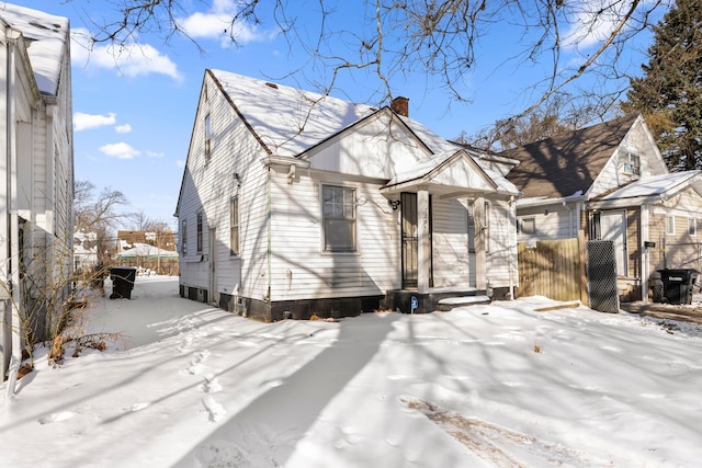 7285 Mansfield St, Detroit, MI 48228 - view of snow covered exterior featuring a chimney