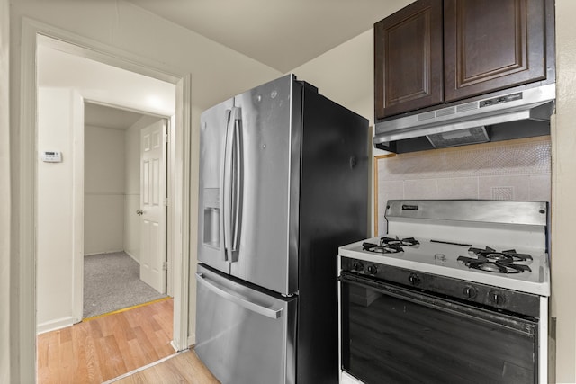 7285 Mansfield St, Detroit, MI 48228 - kitchen featuring gas range gas stove, stainless steel fridge with ice dispenser, under cabinet range hood, light wood-type flooring, and dark brown cabinets