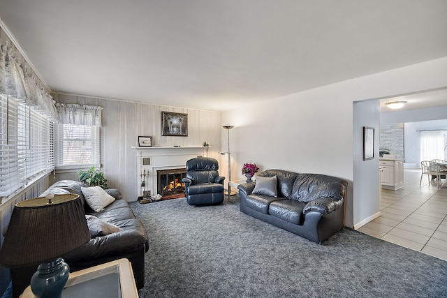 804 E Avon Rd, Rochester Hills, MI 48307 - living area with light colored carpet, a glass covered fireplace, light tile patterned floors, and baseboards