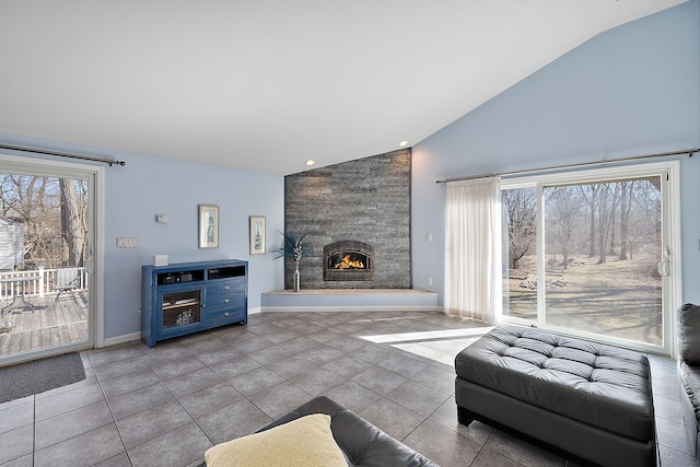 804 E Avon Rd, Rochester Hills, MI 48307 - living room with high vaulted ceiling, tile patterned floors, a stone fireplace, baseboards, and recessed lighting