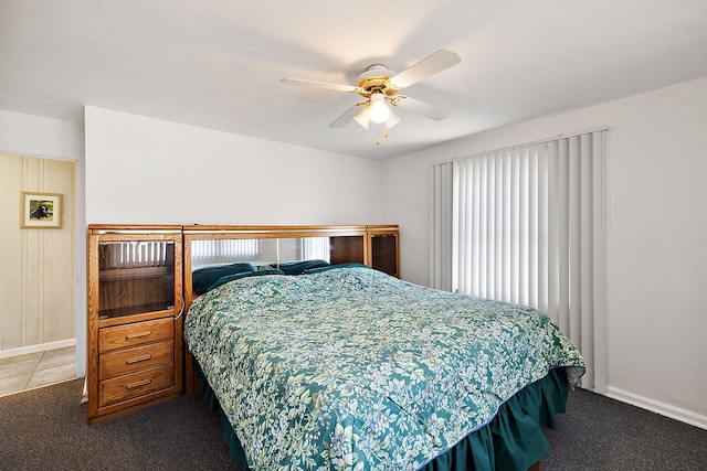 804 E Avon Rd, Rochester Hills, MI 48307 - bedroom featuring carpet floors, multiple windows, baseboards, and a ceiling fan