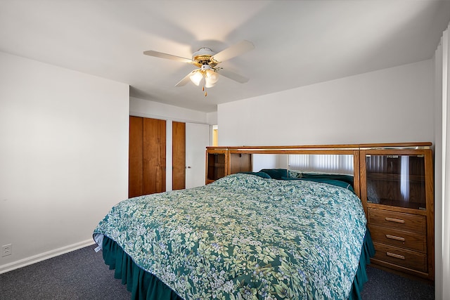 804 E Avon Rd, Rochester Hills, MI 48307 - carpeted bedroom featuring baseboards, a ceiling fan, and two closets