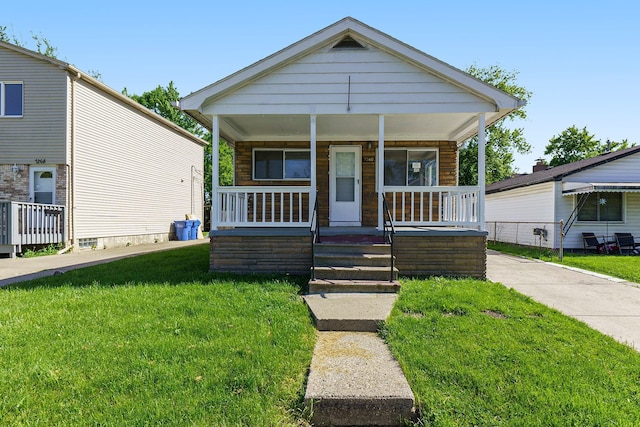 7260 Cadillac Ave, Warren, MI 48091 - view of front of house with a porch and a front lawn