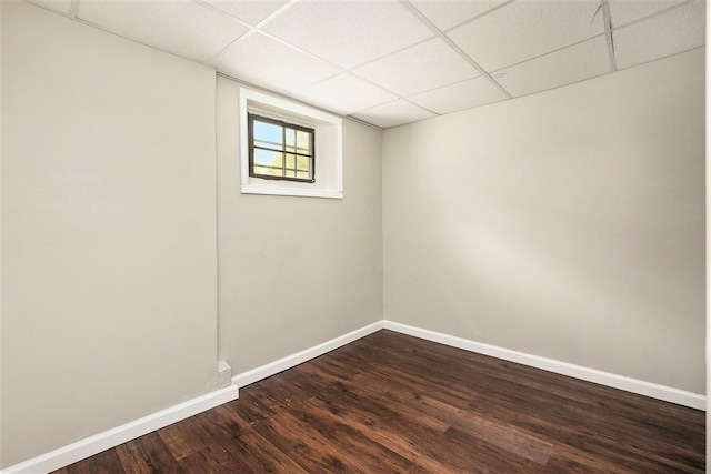 7260 Cadillac Ave, Warren, MI 48091 - unfurnished room with a drop ceiling, dark wood-type flooring, and baseboards