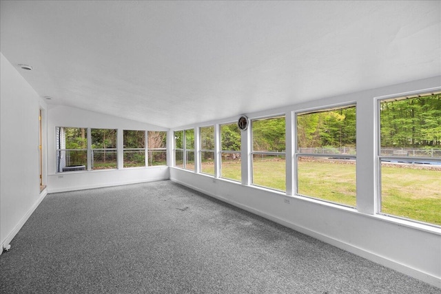 45 E Beech St, Fruitport, MI 49415 - unfurnished sunroom with lofted ceiling, carpet floors, healthy amount of natural light, and baseboards