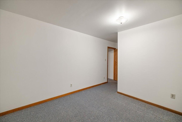 45 E Beech St, Fruitport, MI 49415 - spare room featuring carpet floors and baseboards