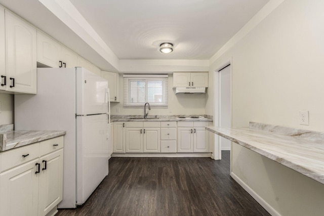 15939 New Hampshire St, Southfield, MI 48075 - kitchen with under cabinet range hood, a sink, freestanding refrigerator, electric cooktop, and white cabinets