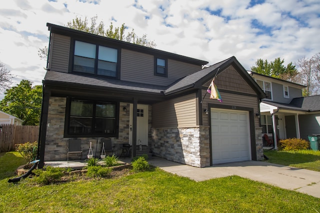 1226 E Bernhard Ave, Hazel Park, MI 48030 - view of front of home featuring stone siding, a porch, concrete driveway, and a garage