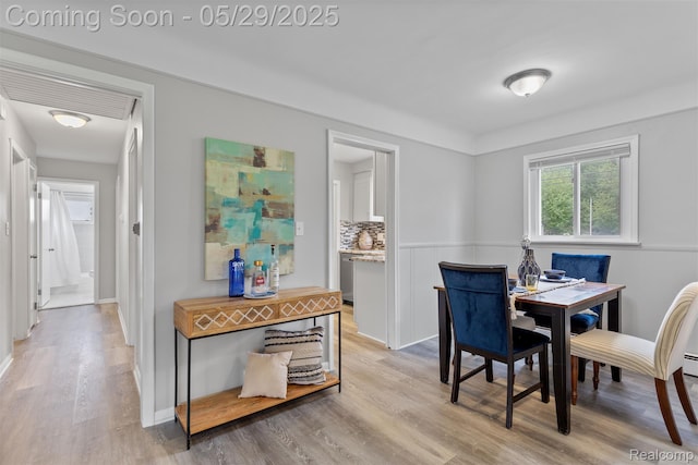 24371 Grove Ave, Eastpointe, MI 48021 - dining area featuring light wood-style flooring and baseboards