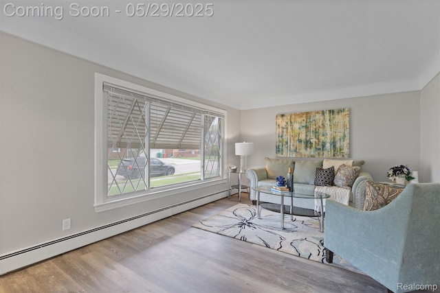 24371 Grove Ave, Eastpointe, MI 48021 - living room featuring baseboard heating and wood finished floors
