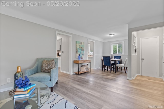 24371 Grove Ave, Eastpointe, MI 48021 - living area with light wood-type flooring and baseboards