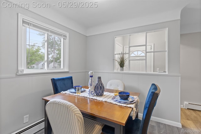24371 Grove Ave, Eastpointe, MI 48021 - dining area with a baseboard radiator, plenty of natural light, and wood finished floors