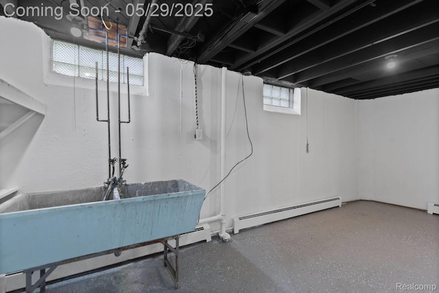 24371 Grove Ave, Eastpointe, MI 48021 - below grade area with a baseboard heating unit and a sink