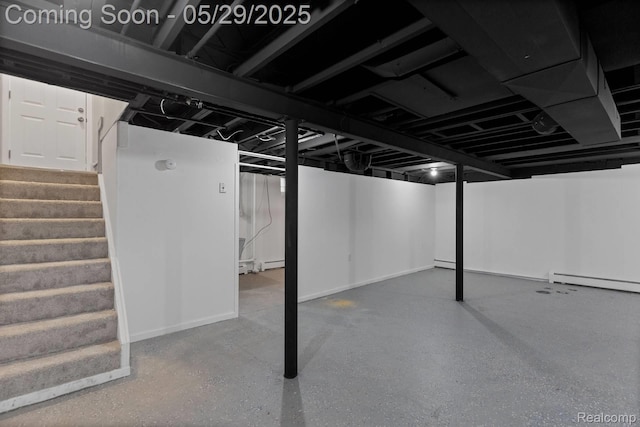 24371 Grove Ave, Eastpointe, MI 48021 - finished basement featuring stairs, a baseboard radiator, and baseboards