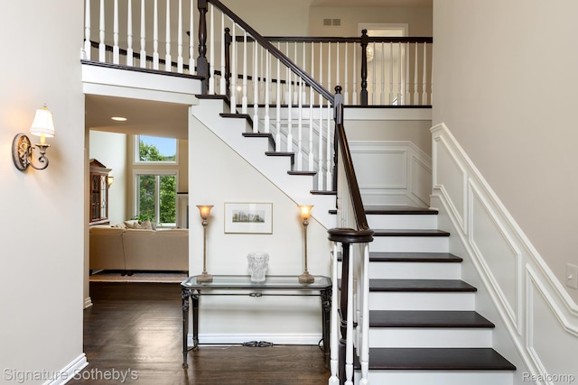 615 Appoline Ct, Rochester, MI 48307 - staircase with wood finished floors, baseboards, a towering ceiling, and a decorative wall