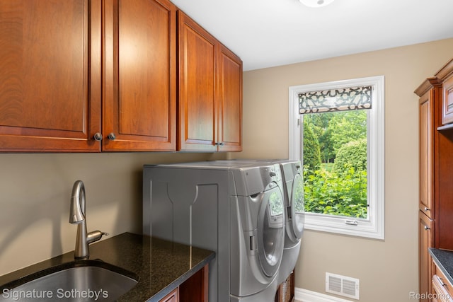 615 Appoline Ct, Rochester, MI 48307 - washroom with separate washer and dryer, cabinet space, and baseboards