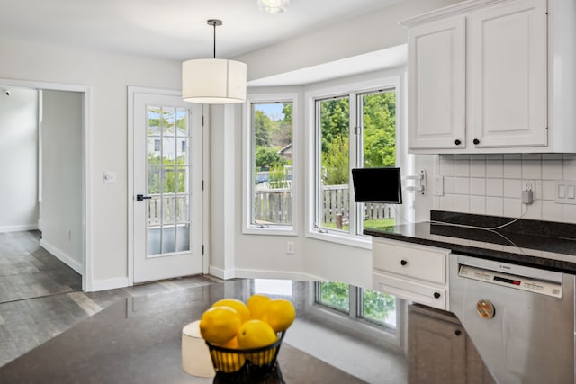 8148 Orchardview Dr, Washington, MI 48095 - kitchen with dishwasher, dark countertops, tasteful backsplash, and white cabinets