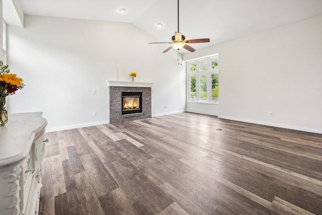 8148 Orchardview Dr, Washington, MI 48095 - unfurnished living room featuring ceiling fan, a brick fireplace, wood finished floors, high vaulted ceiling, and baseboards