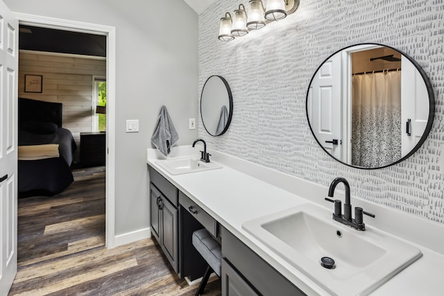 8148 Orchardview Dr, Washington, MI 48095 - bathroom with wood finished floors, baseboards, and double vanity