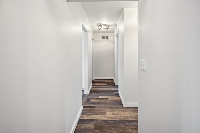8148 Orchardview Dr, Washington, MI 48095 - hallway featuring dark wood-style flooring and baseboards