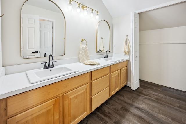 8148 Orchardview Dr, Washington, MI 48095 - full bath with wood finished floors, double vanity, and vaulted ceiling