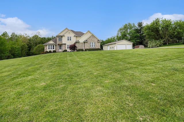 4024 Hosner Rd, Metamora, MI 48455 - view of front of house featuring a garage, an outdoor structure, and a front yard