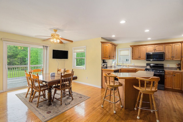 4024 Hosner Rd, Metamora, MI 48455 - dining space with light wood-type flooring, recessed lighting, baseboards, and a ceiling fan
