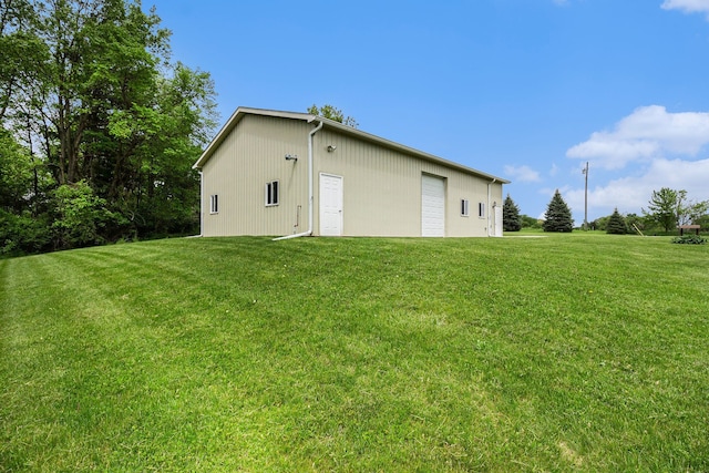 4024 Hosner Rd, Metamora, MI 48455 - view of side of property featuring a lawn, an outbuilding, and a garage