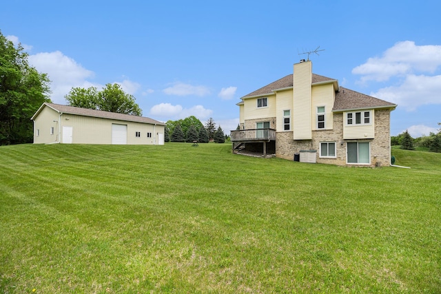 4024 Hosner Rd, Metamora, MI 48455 - back of house featuring a chimney, a lawn, a detached garage, brick siding, and roof with shingles