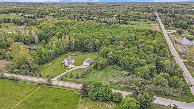 4024 Hosner Rd, Metamora, MI 48455 - aerial view of property and surrounding area with a heavily wooded area